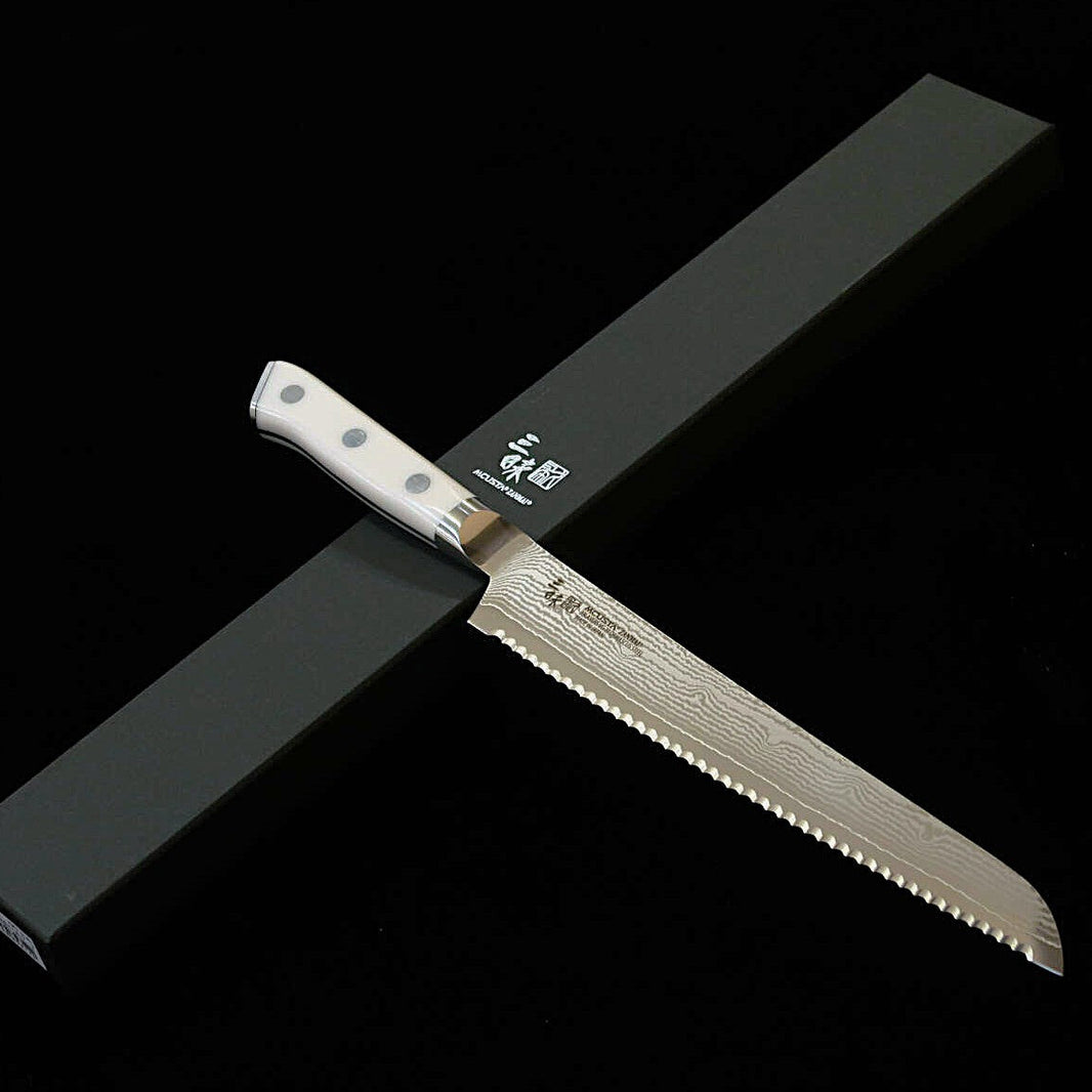 [Nouvelle référence] ZANMAI MCUSTA Classic III Damas – couteau à pain, manche Corian (230 mm)