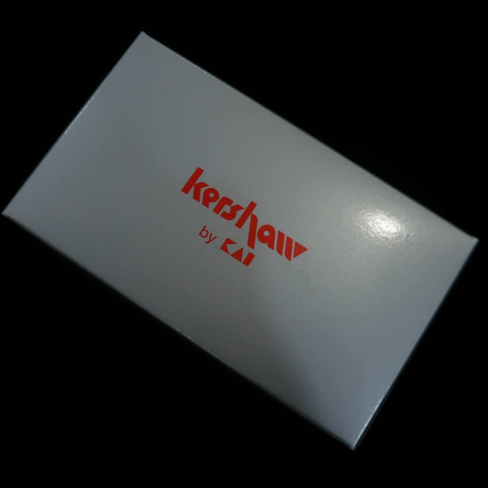 Kershaw Cortauñas tipo hoja con funda de cuero PQ-1002